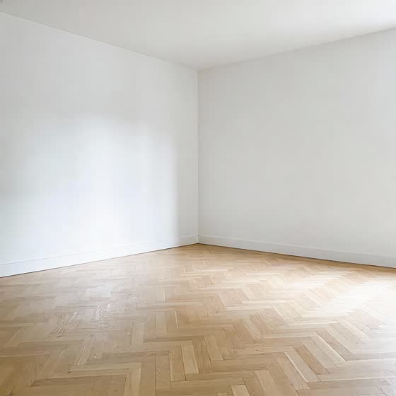 Original photo: an empty room with white walls and a herringbone parquet floor